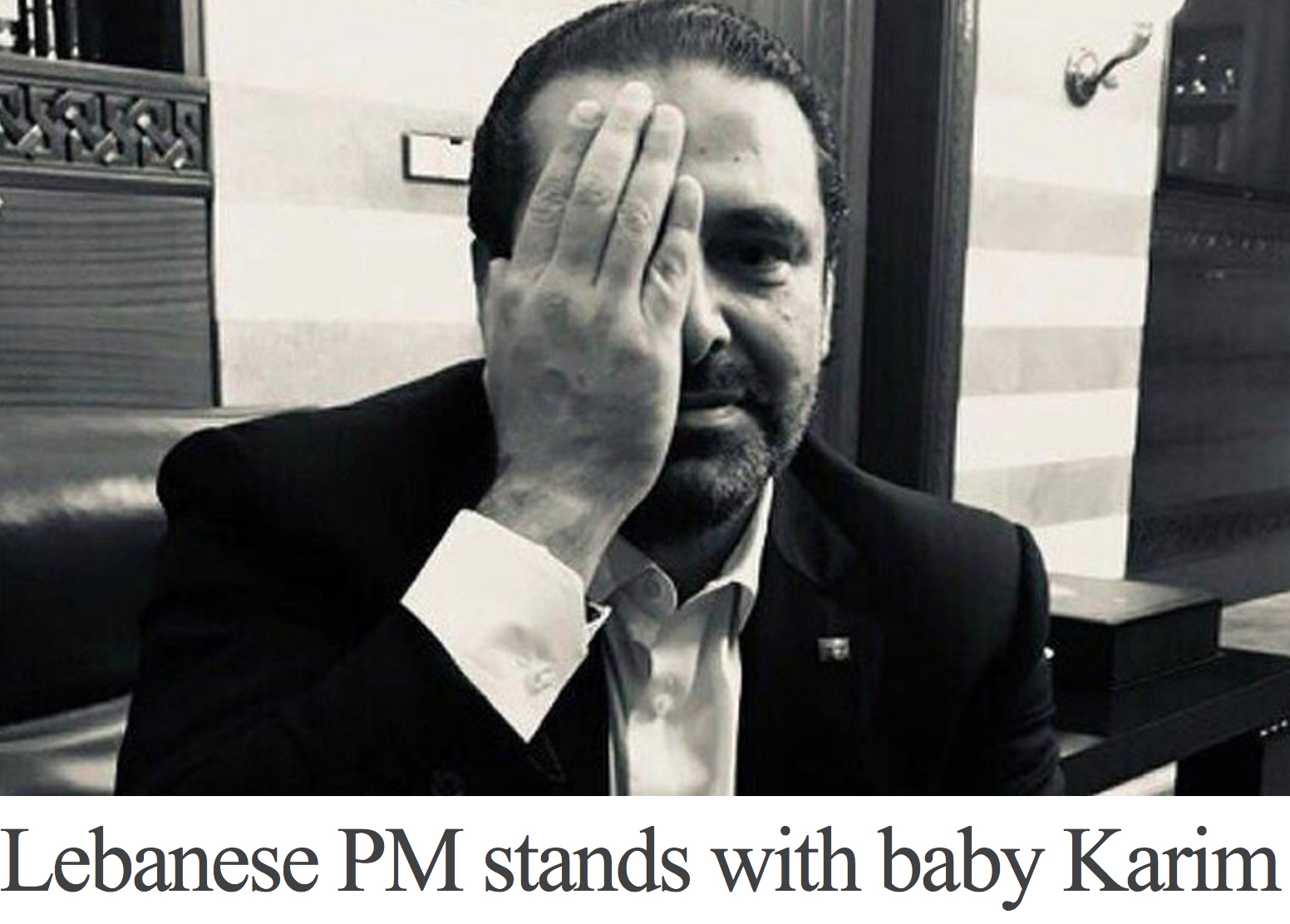 Lebanese prime minister stands with baby Karim